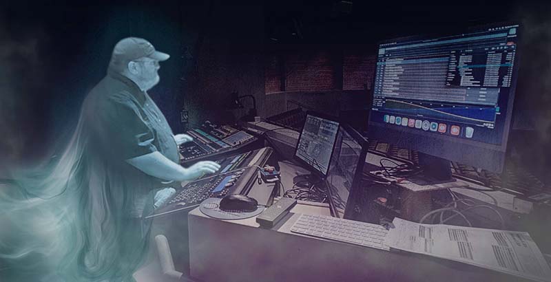 Stylized promotional image of a theater lighting technician working at a control console in a dark booth at The Reif, with glowing computer monitors and a ghostly light effect surrounding the operator.
